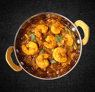 Creamy indian prawn curry in a bowl served with aromatic spices at best mexican restaurant in boat quay
